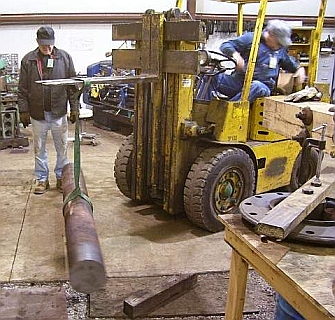 Lifting the crankshaft stock into the lathe