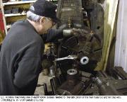 Volunteer operating a lathe